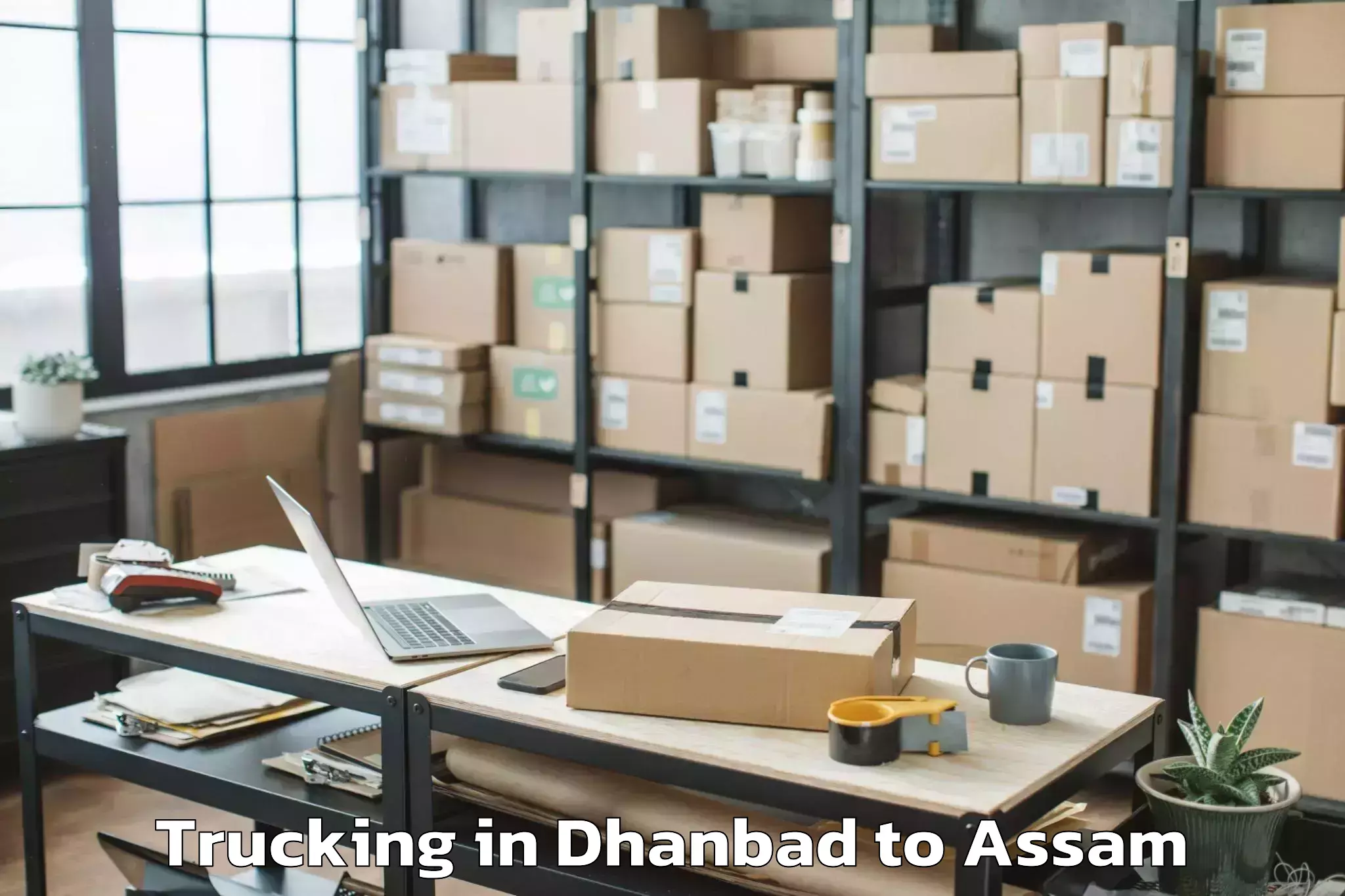 Book Dhanbad to Rangapara Trucking Online